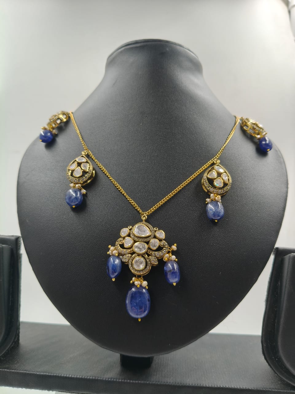Hasli necklace with polki work and blue gemstone
